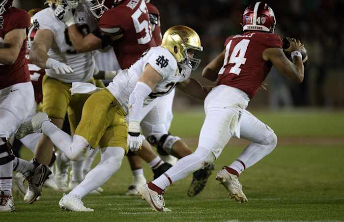 sNov 25, 2023; Stanford, California, USA; Notre Dame Fighting Irish linebacker JD Bertrand (left) flushes Stanford Cardinal quarterback Ashton Daniels (14) from the pocket during the third quarter at Stanford Stadium. Mandatory Credit: D. Ross Cameron-USA TODAY Sports  